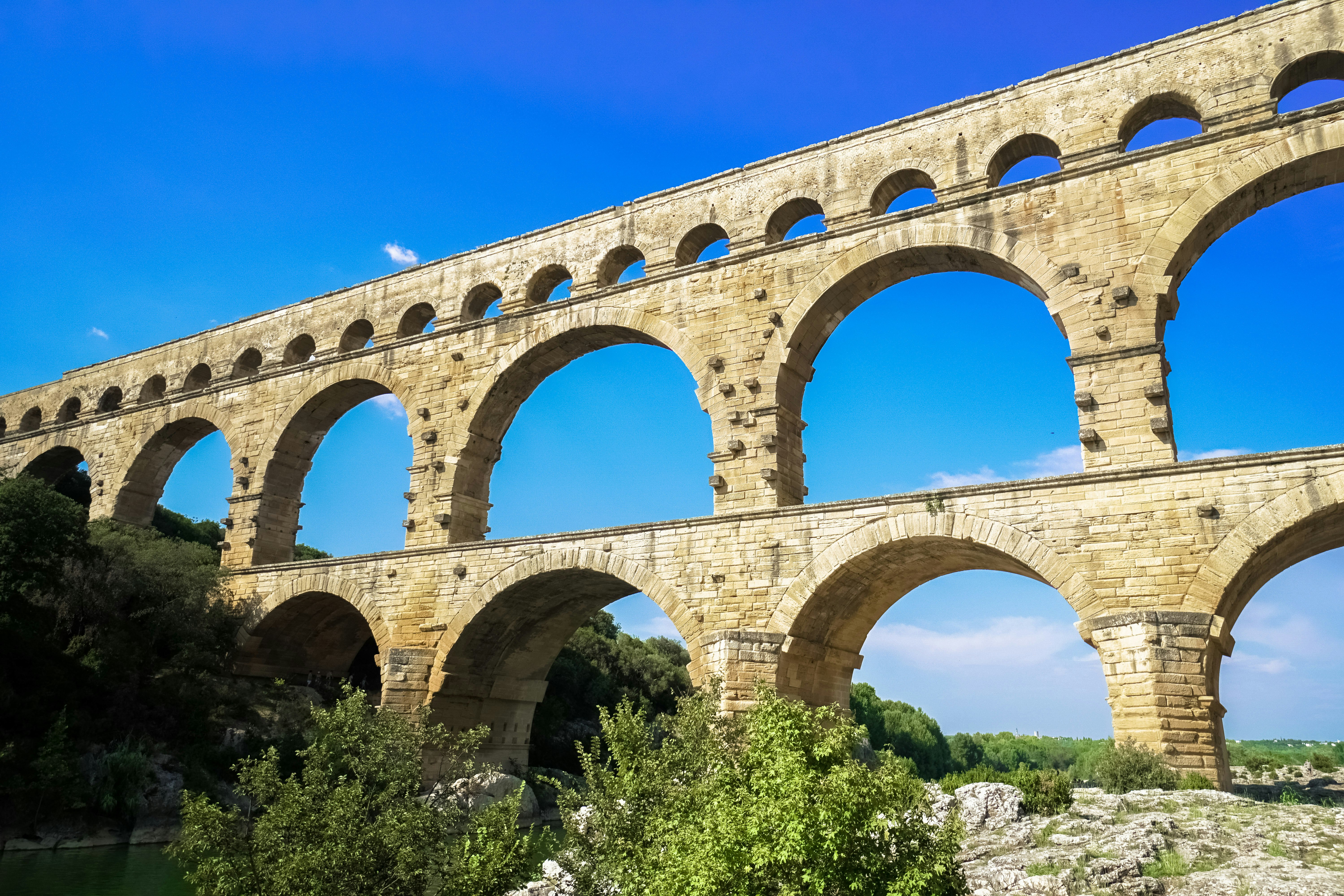 gray concrete bridge under blue sky during daytime